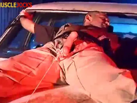 Office-holder Derek da Silva corded to the spandex hood of a car